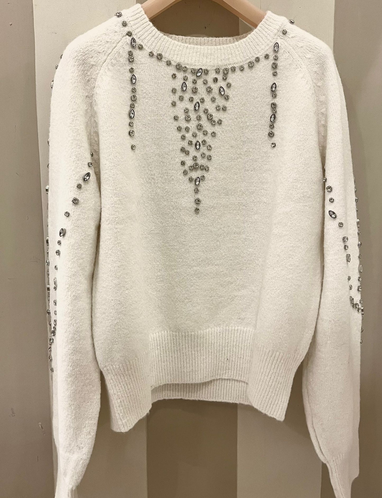 Maglione con applicazioni