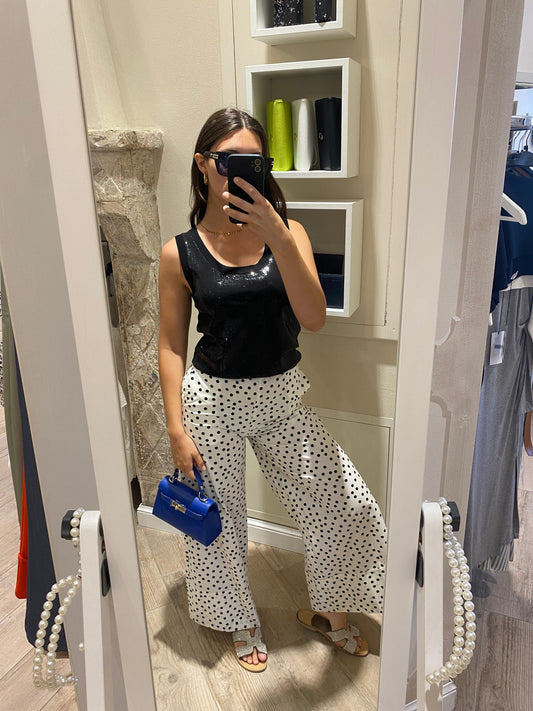 Pantaloni a pois bianchi